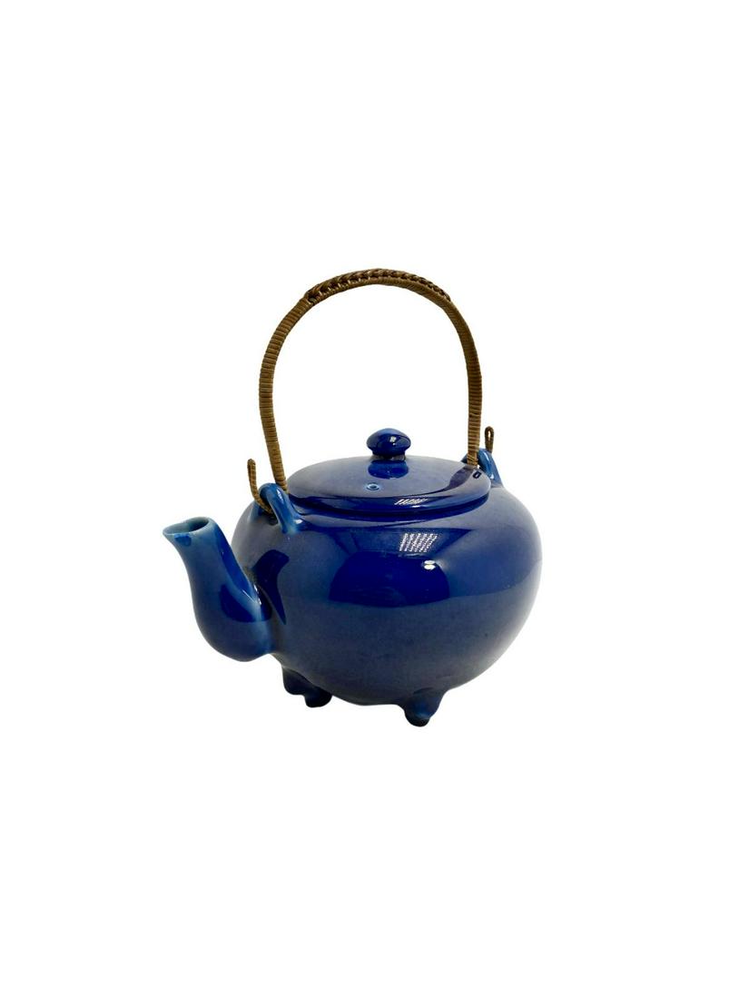 Rookwood Pottery Teapot with Rattan Handle: Rookwood Pottery Teapot with Rattan Handle marked and numbered on bottom XXI 6I6 measures 4" x 7"