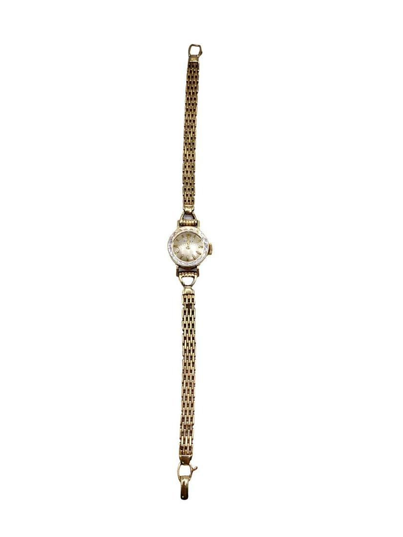 Rolex Ladies 14kt YG Watch: Rolex Ladies 14kt YG Watch measures L: 6", Round Face DIA: 1/2", Cut glass bezel edge, 10.31DWT