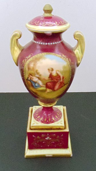 HAND PAINTED ROYAL VIENNA VASE: Hand Painted Royal Vienna two handled Porcelain covered Vase. Depicting romantic scene, with gilt high lighting & scrolls & bead trimming. Height thumb Print hallmark on bottom as pictured. SHIPPING &