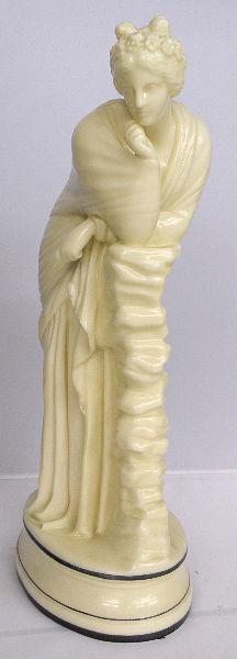 ROYAL WORCESTER PORCELAIN FIGURE OF A WOMAN: Royal Worcester Porcelain Figure of a woman Titled "Day Dreaming" in roman attire leaning on a stack of book on a porcelain base. with black trimming. The woman has a wreath of flowers around her head