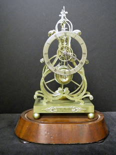 Antique Mid 19th Century Brass Skeleton Clock: Mid 19th Century good brass striking skeleton clock . The plaque on front reads R.E. Mosely Boston. Mounted on a walnut plinth, the silvered chapter ring having black roman numerals. Please note: cloc