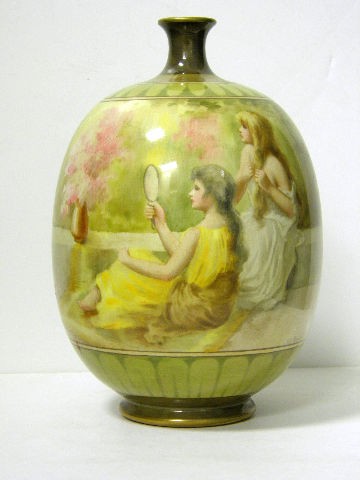 Doulton Burslem Hand Painted Vase: Good hand painted Doulton Burslem vase. Artist signed H.G. Theaker. From the Luscan Ware series. Decorated with two young women wearing Grecian dresses. Lot being sold A.F. - losses to top of rim. Mea