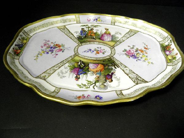 Antique Hand Painted Meissen Porcelain Tray: Antique meissen tray. Hand painted with figures being serenaded by musicians in a garden scene and panels of floral sprays. Blue underglazed crossed sword marks.Having a raised decorated Gallery borde