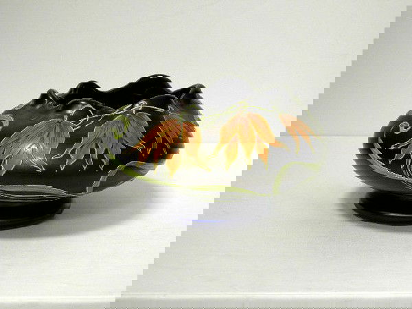 Austrian Iridescent Art Glass Scalloped EdgeBowl: Squat form irridiscent Austrian Art glass vase. The body has hand painted floral decoration on a blue and purple background. Signed NS S60 to base. Measures 3" high and 5 1/2" wide. Shipping within th