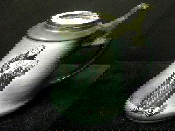 Unusual O'Hara Dialco American Stein: A very unusual O'Hara Dial & Co stein. The body decorated with a hand painted scene of a monk carrying a pig. The lid mounted with a portrait of a native American Indian brave. The base marked O'Hara