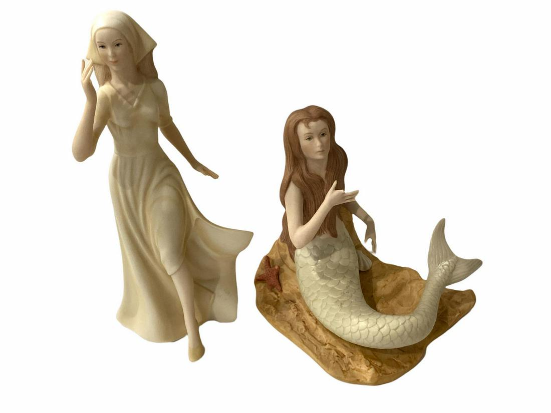 Pair of Goebel Laszlo Ispanky Porcelain Figurines: Pair of Goebel Laszlo Ispanky Porcelain Figurines includes Peasant Girl measures H: 10" and Mermaid measures H: 7" x W: 6". Missing one finger, sold as is