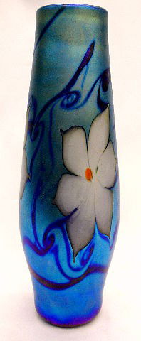 Vandermark Blue Iridescent Vase: Vandermark blue iridescent art glass Vase with hand painted floral design accented with a m agnificent cobalt blue backround. Signed on base. 10 1/2", height. SHIPPING & REQUIRED INSURANCE $35.00 WITH