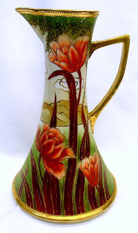 Nippon Hand Painted Porcelain Pitcher: Nippon hand painted porcelain Pitcher depicting an outdoor grassy landscape, gilded handle. This Fine quality pitcher has Nippon stamp on base, 10 1/4" height. SHIPPING & REQUIRED INSURANCE $35.00 WIT
