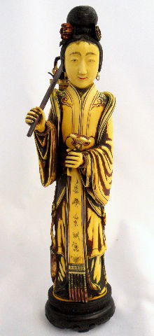 Carved Oriental Figure of Woman With Lantern: Carved oriental figue of a woman carrying a lantern on a stick on her right hand . 10" height on 1 1/4" base. Shipping And Required Insurance Within The Continental US $40. No International Shipping O