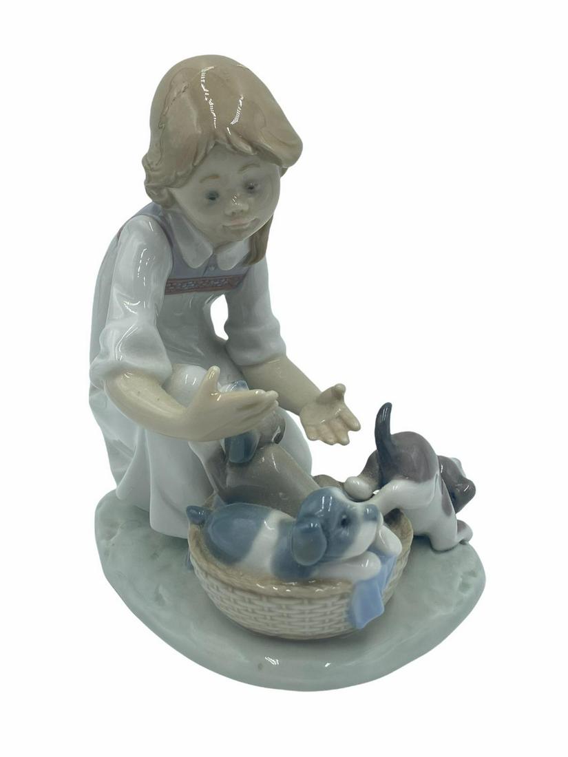 Lladro #5595 Joy in a Basket Girl with Puppies: Lladro #5595 Joy in a Basket Girl with Puppies Porcelain Figurines measures 6" x 5 1/2"
