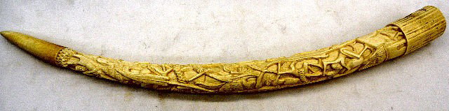 African Hand-carved Figural Ivory Tusk.: African Hand-arved Figural Ivory Tusk. Outstanding Massive African Hand carved Figural Tusk. Carved In High Relief Figures On Animal And People Who Appear to be Climbing to The Top Of the Tusk. Measur