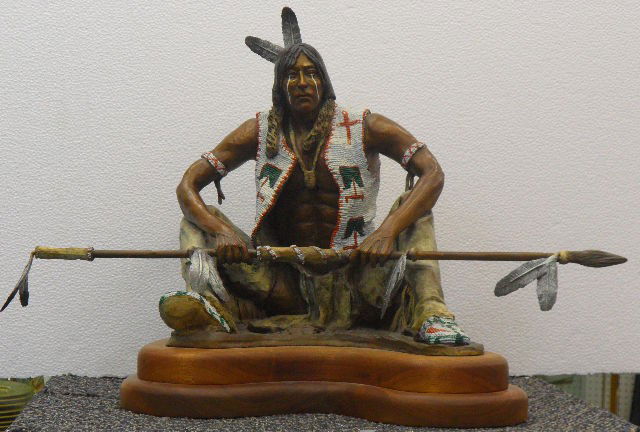 Marie Barbera Bronze Sculpture of Native American: Fine quality Marie Barbera bronze Sculpture of a native American. This bronze depicts a young hunter sitting anxiously waiting to hunt. Young man has native American spear resting against his legs. Br