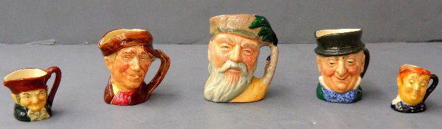 Five Royal Doulton Miniature Toby Mugs: Five highly collectable miniature character Toby mugs by Royal Doulton. Ranging in size from Robinson Crusoe D6546 to Old Charley D6046 plus three others. Measuring 3" to 1 1/4" respectively. Shipping