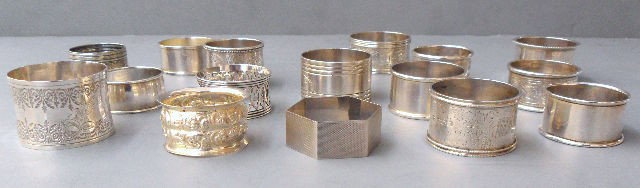16 Piece Silver Napkin Ring Collection : 16 Piece English napkin ring collection consisting of 16 napkin rings. This collection of silver napkin rings consists of 12 English silver napkin rings and four sterling silver napkin rings. Your din