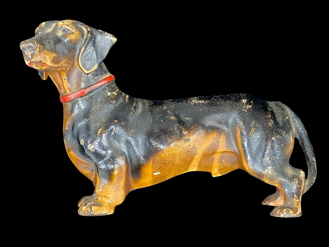 Hubley Dachshund Cast Iron Doorstop Dog Figure: Hubley Dachshund Cast Iron Doorstop Dog Figure measures 6" x 10"