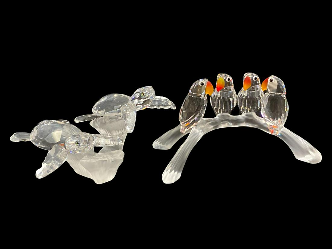 Pair of Swarovski Crystal Figurines: Pair of Swarovski Crystal Figurines includes Four Parrots Love Birds sitting in branch measures H: 2" x L: 4 3/4" and Baby Sea Turtles measures H: 2"