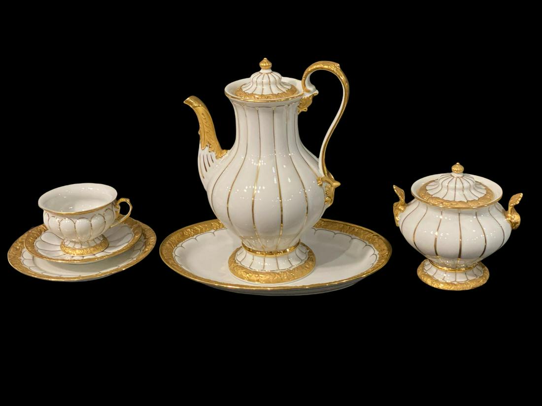 Lot of 36 Meissen Porcelain Tea Set in Gilt Floral Design: Lot of 36 Meissen Porcelain Tea Set in Gilt Floral Design includes 11 cups, 11 saucers, teapot that is 11" tall, creamer, sugar bowl and oval plate that is 11 3/4" in diameter.