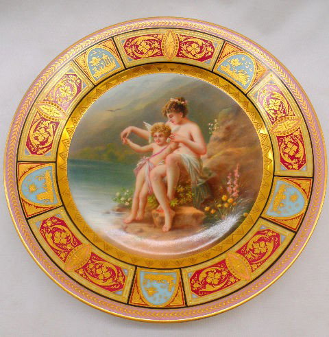 Royal Vienna "Venus u. Amor " Portrait Plate: Beautiful Royal Vienna hand painted decorative collectors plate. It is called "Venus u. Amor". It depicts The Goddess Venus and Cupid. This plate measures about 9-1/2" in diameter. The lower right are
