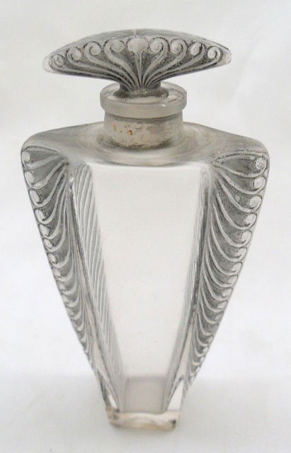 Rene LaLique Crystal Perfume Bottle: Rene LaLique deco style perfume bottle. Measures about 4-1/4" tall and the bottom is marked; R LaLique. This stylish bottle is in very good condtion. Shipping Within The Continental US $25 plus Requir