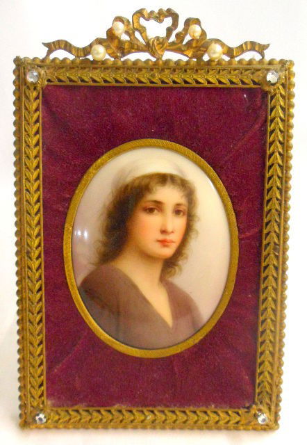 KPM Quality Hand Painted Porcelain Plaque: Small hand painted porcelain oval plaque. Depicts a portrait of Ruth of Landelle with KPM quality. The plaque only measures 3-1/4" by 2-1/2" and is set in a brass jeweled frame with velvet matting. Co