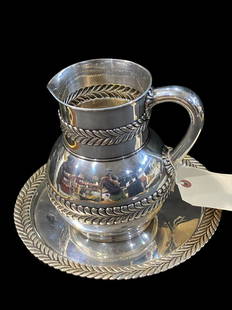 Tiffany & Co Wave Edge Water Pitcher with Matching Tray, (1884) Laurel, Hollowware Set: Tiffany & Co Wave Edge Water Pitcher with Matching Tray, (1884) Laurel, Hollowware Set. Pitcher marked 4706-7976, matching tray is marked 5766-6216 C 11 measures W: 11". Pitcher weighs 795 grams and