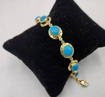 Women's Estate 18K Cabochon Turquoise Yellow Gold Bracelet: Fantastic women's estate bracelet crafted of yellow gold featuring oval openwork rim stations featuring oval cabochon cut high quality turquoise stones. Completed with lobster claw claps. Measures