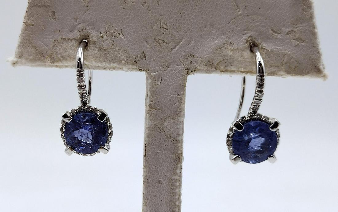 Superoro Italy 18K Tanzanite & Diamond White Gold Earrings: Women's designer signed Superoro, Italian 18k white gold pierced hook back drop earrings featuring center round tanzanite gemstones approx. 3.61ctw surrounded by a halo of diamonds that trial up the m