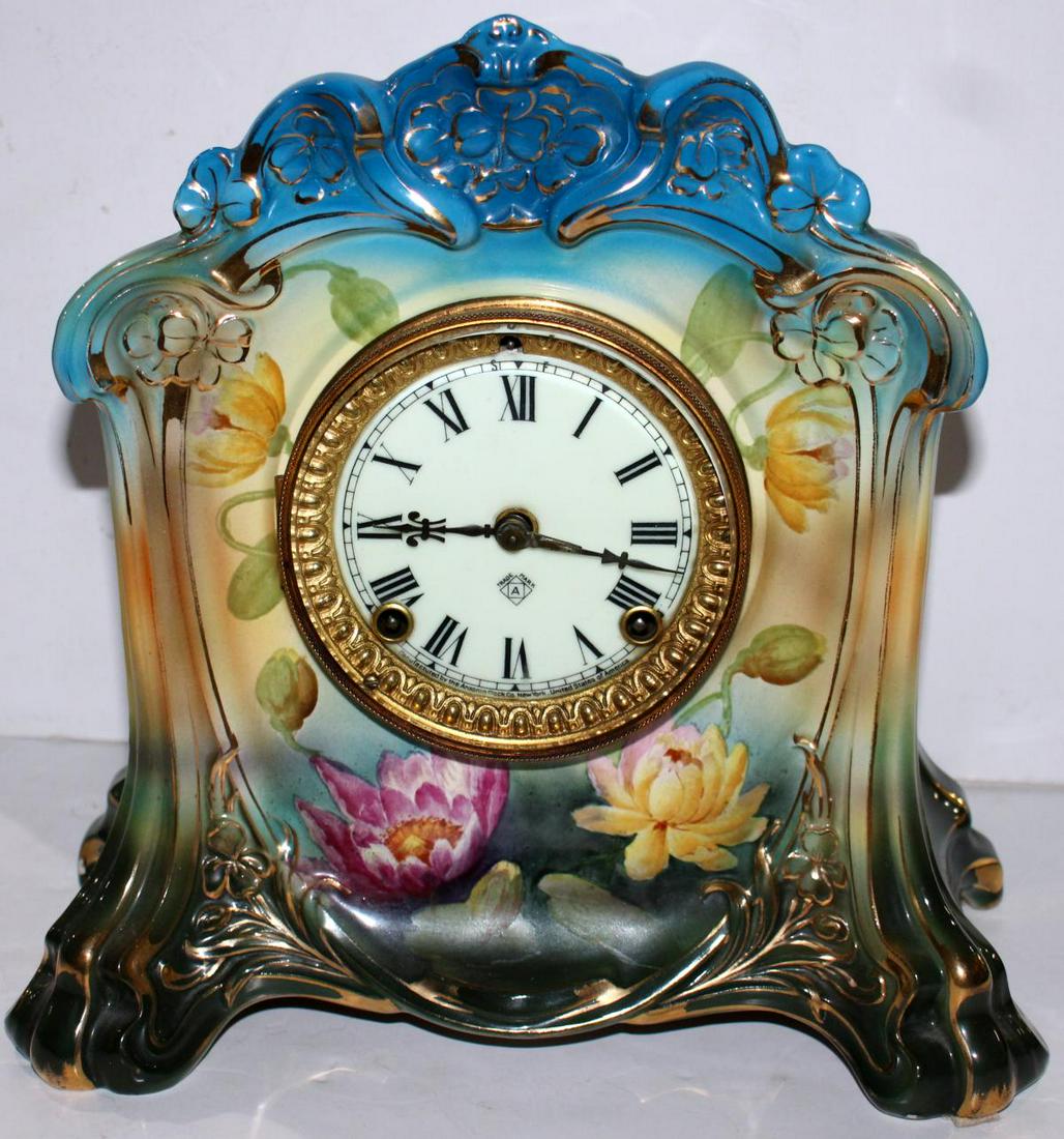 Royal Bonn Porcealin Case "La Celle" Ansonia Mantle Clock: Antique Royal Bonn German hand painted porcelain "La Celle" mantle clock with Ansonia mechanical movement. Measures approx. 12" height x 9" width x 6" depth.