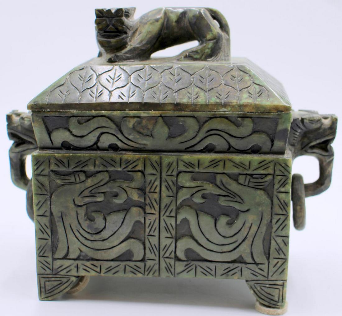 Chinese Hand Carved Jade Foo Lion Figural Boxq: A Chinese hand carved jade stone box having a figural foo dog design. Measures approx. 7 1/2" height x 6" width x 4" depth.