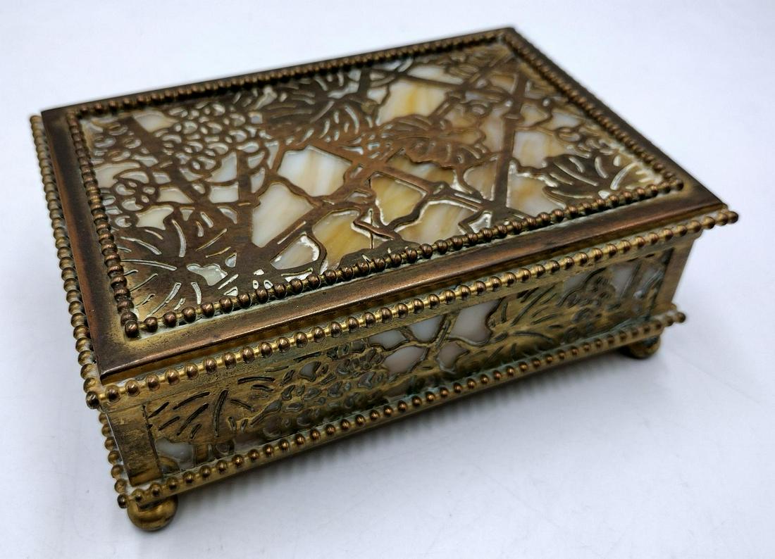 Antique Tiffany Studios Bronze & Slag Glass Pine Needle Desk Box: Antique Tiffany Studios New York bronze and green slag glass hinged desk box. Measures approx. 2 1/4" height x 6" width x 4" depth. The lid is off and has a crack in glass. We are selling this piece "
