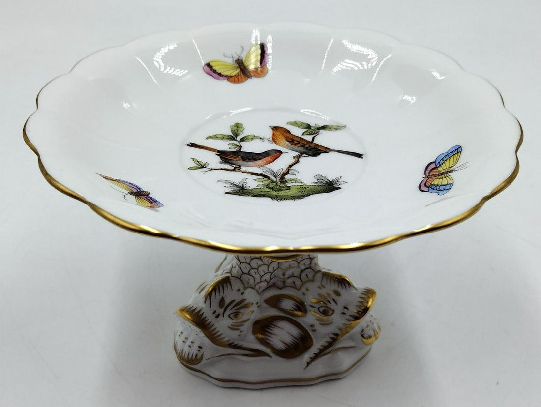 Herend Hungary Rothschild Porcelain Small Fish Foot Compote: Herend Hungarian hand painted footed compote dish in the Rothschild pattern depicting birds and butterflies having mythological Greek dolphin footed design with scalloped top. Blue marks to bottom and