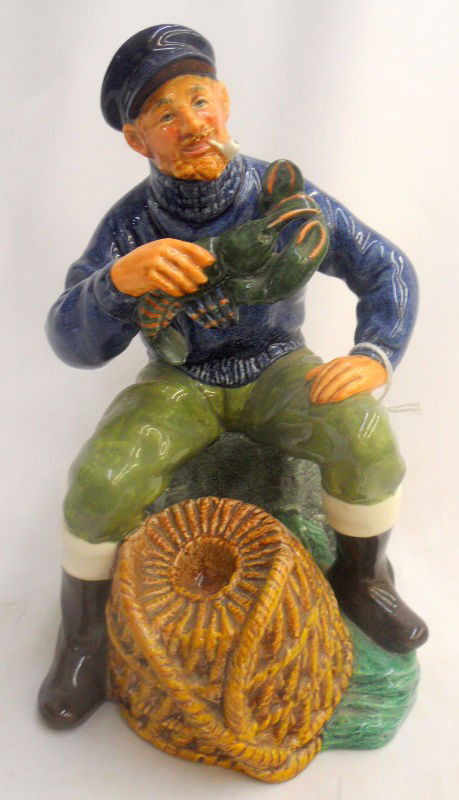 Royal Doulton "The Lobster Man" #2317: Beautiful Royal Doulton entitled "The Lobster Man" and numbered #2317. This figurine was designed by M. Nicoll. It depicts a man smoking a pipe sitting down while holding a lobster. Retail price is at