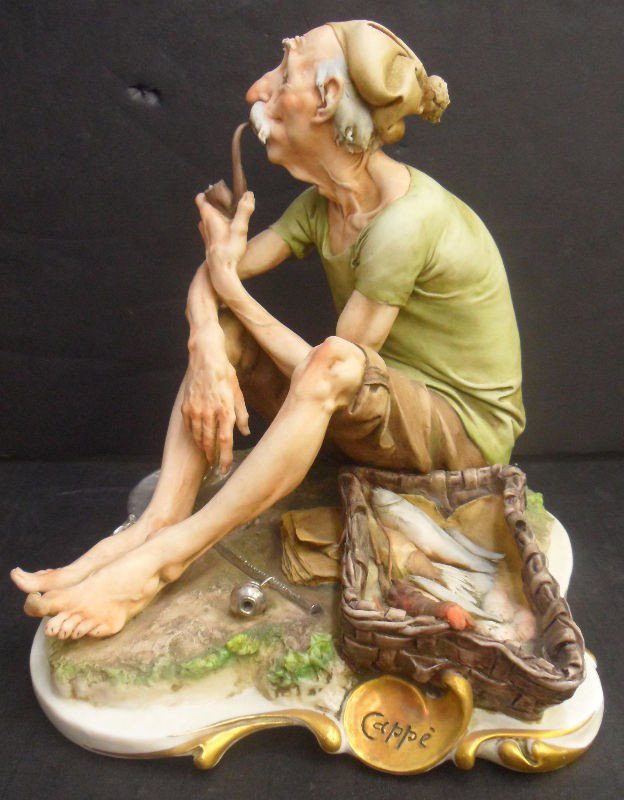 Italian Capodimonte "Pescadore" Figure: Italian Capodimonted porcelain figure of a pescadore (fisherman). Hand-painted detailed figure. Signed. Measures 8 3/8" high x 8 1/2" wide x 9 1/2" deep. Shipping within the continental US is $25 plus