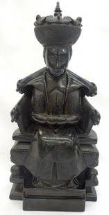 Chinese Carved Black Amber Emperor Seated on Throne: Important Chinese Black Amber carving of a Emperor on a throne carved from one piece of amber. The carving is finely decorated on front and back. The emperor is seated with clasped hands wearing a