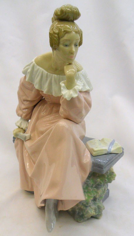 Lladro Porcelain Figure "In The Garden" No. 4978: Beautiful rare retired Lladro figuring of a woman "In the Garden" wearing a pink long sleeved gown with ruffles on her off the shoulder neckline and with ruffled cuffs and high top boots. She is holdi