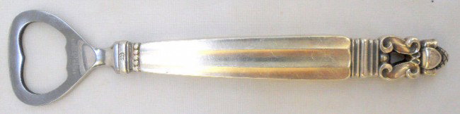 Georg Jensen Sterling Acorn Pattern Bottle Opener: Georg Jensen Sterling Silver hollow-handled bottle opener. Extremely popular Acorn pattern with Georg Jensen marking on base, hand and opener. No monograms or removals. Measures 6 1/8" high x 1 3/8" w