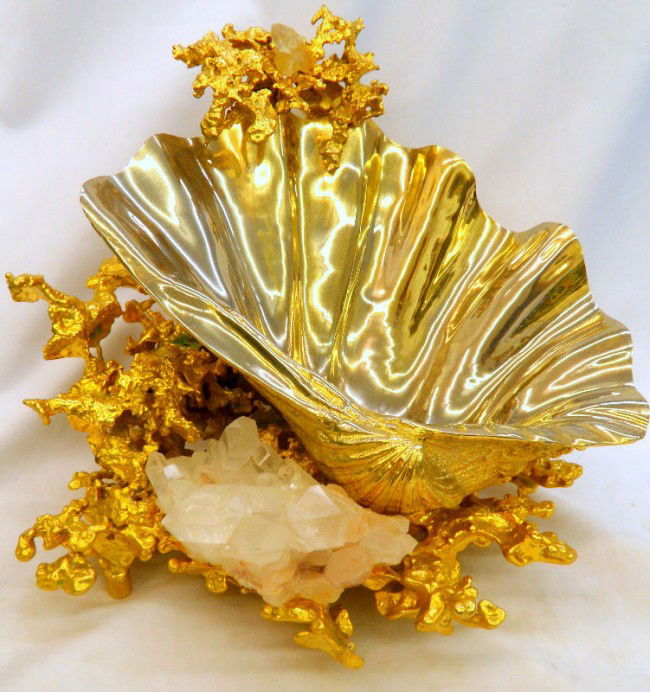 Art Deco Shell Shaped Centerpiece: Heavey Art Deco Shell design centerpiece. Silver color in the shell shape portion and a gold nugget design surrounding it. Measures 11" high x 14" wide x 12" long. Please call for shipping plus requir
