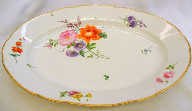 Meissen Porcelain Hand-painted Turkey platter: Meissen hand-painted porcelain turkey platter with flower decoration. Measures 2 1/2" high x 19 3/8" wide. Shipping within the continental US is $40 plus Required insurance. For international shipping