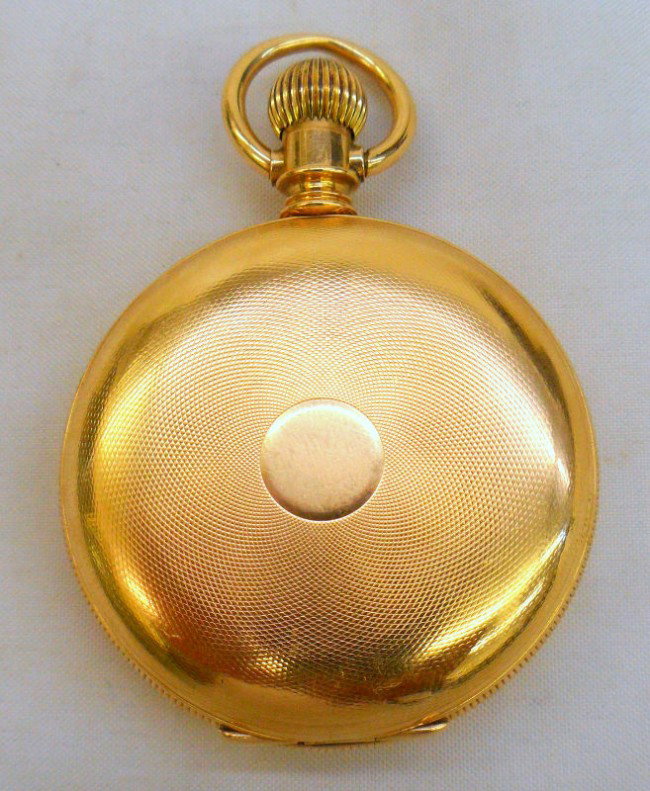 18K Yellow Gold Eligin Pocket Watch: 18K Yellow gold Hunters case pocket watch by Elgin. This vintage watch features a manual wind 50MM face with white porcelain dial & black hands with markers. Watch has sub-second hand with roman numer