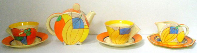 Clarice Cliff "Melon" Pattern Teaset: Handpainted teaset by Clarice Cliff in the "Melon" pattern circa 1932, comprised of a teapot and cover, cream jug, two cups and saucers, and side plate. Cup - 2 1/2" x 4 1/2", plate - 5 3/4" diameter,