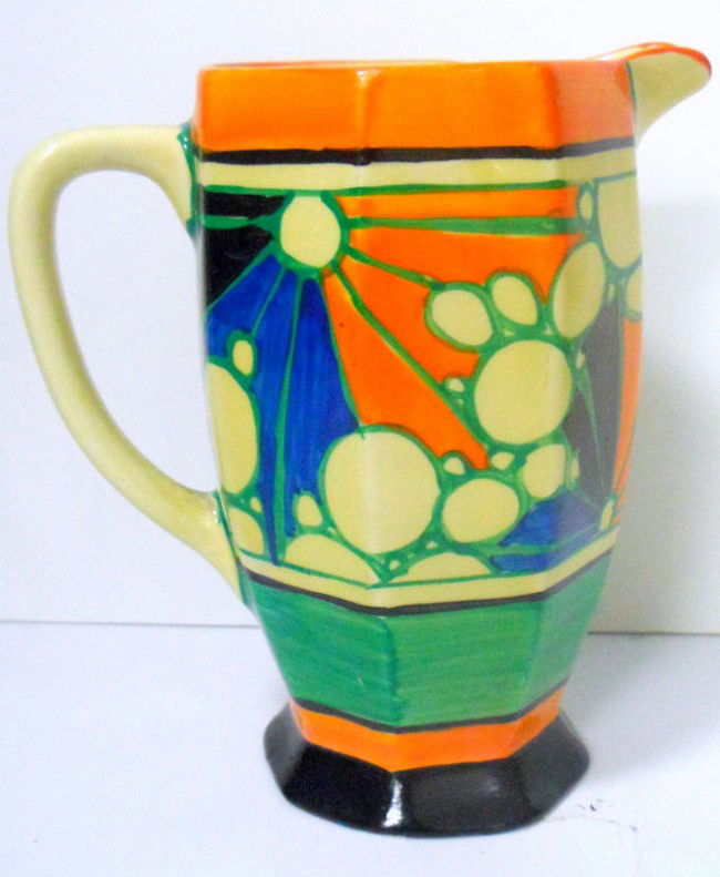 Clarice Cliff Fantasque "Athens" Jug: Handpainted boldly colored Clarice Cliff Fantasque "Athens" Jug. This style of Clarice Cliff's work evolved in the 1928-1934 period. Signed on bottom. Measures 6 1/4" x 3 1/2" x 5 5/8". Shipping withi
