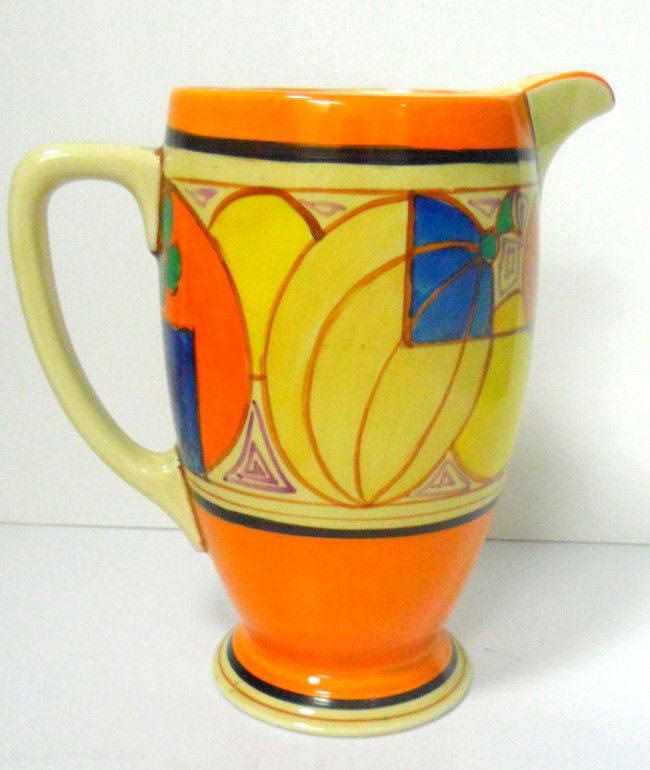 Clarice Cliff Fantasque "Melon" Jug: Brightly hand-painted Clarice Cliff fantasque jug decorated in the "melon" pattern. While this piece is definitely utilitarian it represents a great piece of Clarice Cliff pottery from a historical pe