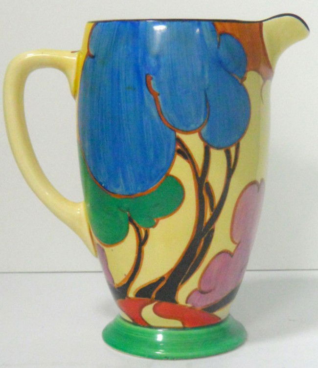 Clarice Cliff Bizarre Fantasque Jug or Pitcher: Clarice Cliff's early works were called Bizarreware and this Fantasque Jug or pitcher is a great example. Hand painted in the "Autumn" pattern. Signed on bottom. Measures 7" x 6" x 9". Shipping within
