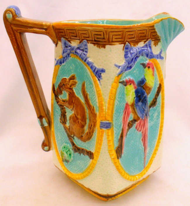 Fielding Majolica Pottery Pitcher: Lovely English Majolica pitcher by Fielding. It is in excellent condition with no wear, chips or repairs. Two sides feature birds and two sides feature a squirrel, the bottom is marked Fielding. 10'' 