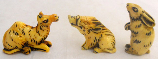 Three Chinese Carved Ivory Netsukes: Collection of three Chinese carved ivory netsukes figures of animals. Compromised of a rabbit, a boar and a camel. Three great netsukes for any astute netsuke collector. Measures, boar - 1 1/4" high x