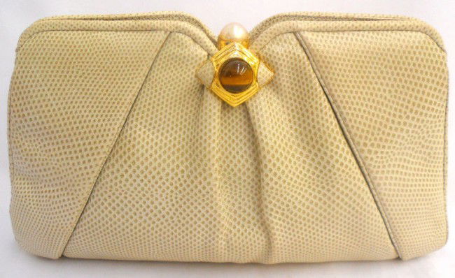 Judith Leiber Tiger Eye and Pearl Clasp Clutch: Judith Leiber leather clutch with tiger eye and pearl clasp. This stunning little clutch has the original mini comb inside of the clutch. Measures 5 3/4" high x 10 3/8" wide x 2 3/8" depth. Excellent