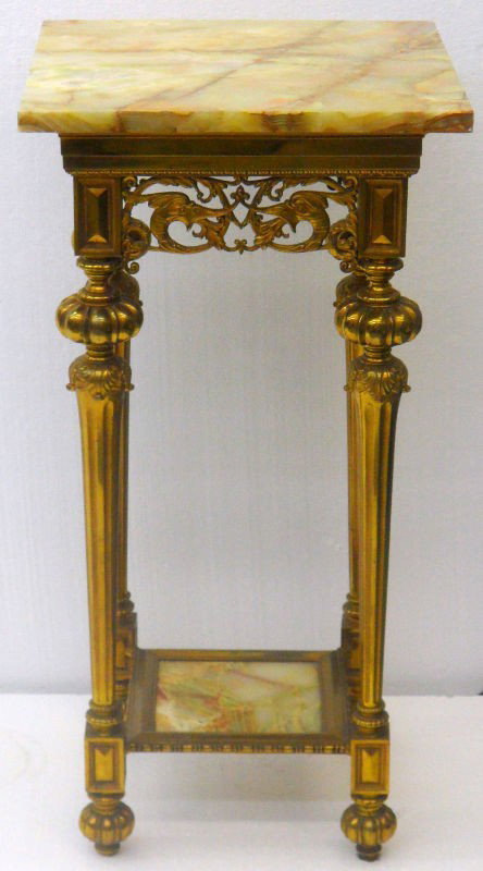 Dore Bronze & Onyx Top Two Tier Pedestal Table: Dore bronze two tier pedestal table with beautiful onyx top. The sides are all beautifully detailed. This charming pedestal table would look great in any home. Measures 31 5/8" high x 15 7/8" wide x 1