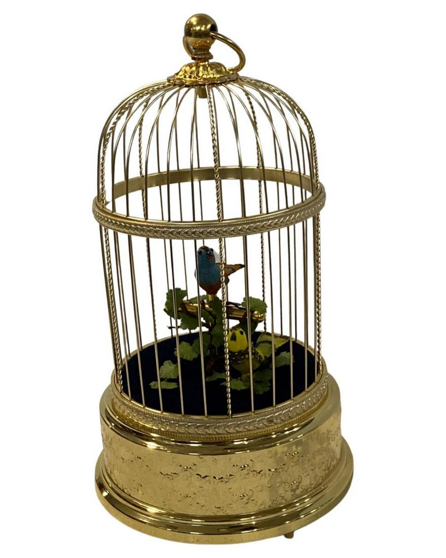 Signed Reuge Swiss Gilt Brass Automatic Singing Birds Music Box Cage: Signed Reuge Swiss Gilt Brass Automatic Singing Birds Music Box Cage. Signed Saint Croix on bottom with original box measures H: 12"
