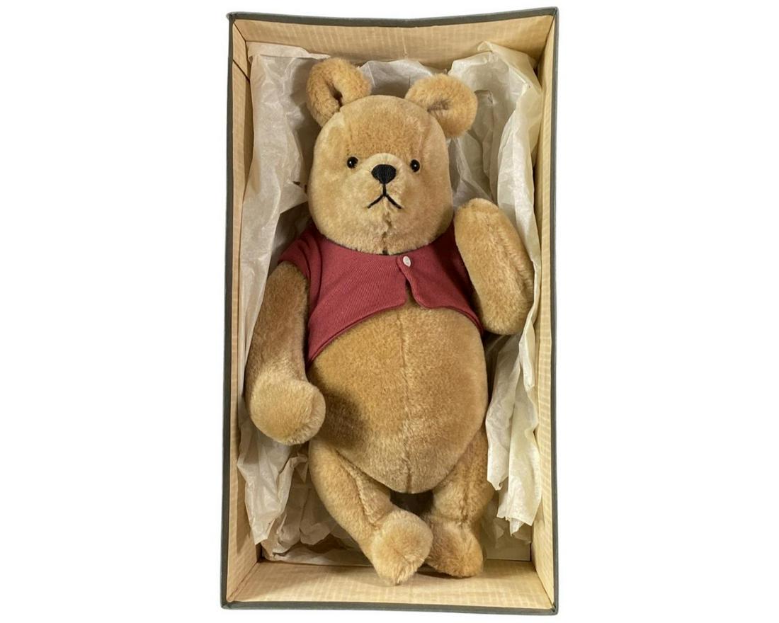 Vintage R. John Wright Winnie The Pooh Limited Edition Doll: A vintage R. John Wright life size "Winnie The Pooh" doll with original tag and box. Limited edition number 1934/2500. Doll measures approx. 19" height. Doll and box appear well preserved. From a non-