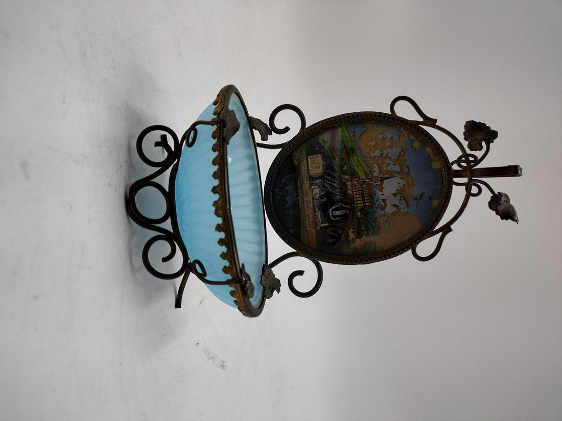 Antique French Reverse Painted Blue Opaline Glass Notre-Dame Trinket Bowl: Antique French bronze mounted trinket ring bowl featuring a reverse painted glass plaque depicting the Church of Notre-Dame de Lourdes. Basin crafted of blue opaline art glass. Measures approx. 5" hei